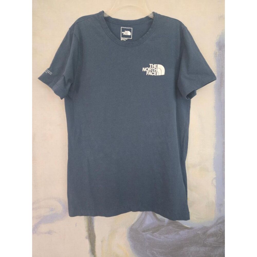 The North Face Women’s Teal Blue Graphic T-Shirt. Size Small. Pre-owned